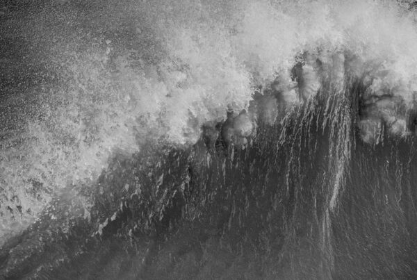 Stunning image of individual wave breaking and cresting during violent windy storm in black and white with superb detail