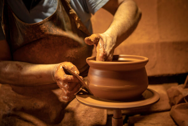 Craftsman making pottery