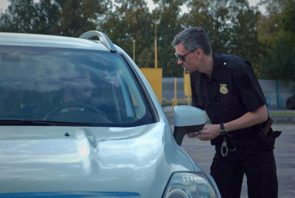 Police officer stopping the driver of a vehicle