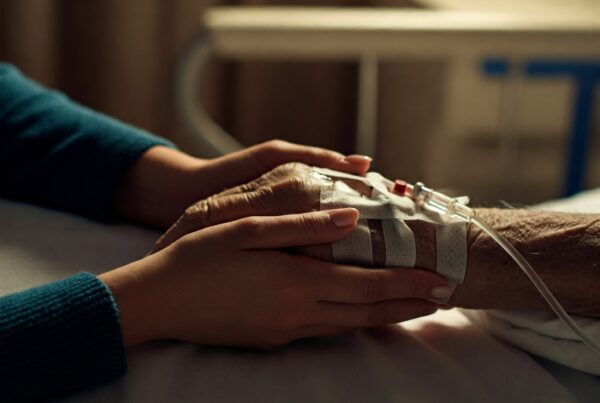 Holding a loved one's hand in the hospital.